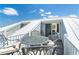 Balcony with metal table and chairs offering seating and bright sky views at 7548 Palm Island S Dr # 1724, Placida, FL 33946