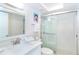Bright bathroom featuring a glass enclosed shower, mosaic tile, and vanity with a large mirror at 7548 Palm Island S Dr # 1724, Placida, FL 33946