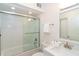 Bathroom featuring a tub with glass doors, a vanity with a mirror, and white tile at 7548 Palm Island S Dr # 1724, Placida, FL 33946