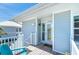 Inviting beach house entrance with a charming porch, calming colors, and a welcoming Hello mat at 7548 Palm Island S Dr # 1724, Placida, FL 33946
