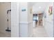 Bright hallway with white wainscoting, leading to the staircase and living area at 7548 Palm Island S Dr # 1724, Placida, FL 33946