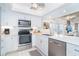Modern kitchen with stainless steel appliances, quartz countertops and easy access to dining area at 7548 Palm Island S Dr # 1724, Placida, FL 33946