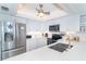 Updated kitchen featuring stainless steel appliances, quartz countertops, and white cabinetry at 7548 Palm Island S Dr # 1724, Placida, FL 33946