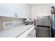 Well-equipped laundry room with ample counter space, modern appliances, and storage cabinets at 7548 Palm Island S Dr # 1724, Placida, FL 33946
