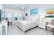 Main bedroom with white furniture, tile floors and shuttered windows offering views of the Gulf at 7548 Palm Island S Dr # 1724, Placida, FL 33946