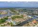 Stunning aerial view of waterfront homes on canals leading to the Gulf in a coastal community at 8180 Burwell Cir, Port Charlotte, FL 33981