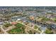 An aerial view of a waterfront neighborhood with canals and beautiful homes at 8180 Burwell Cir, Port Charlotte, FL 33981