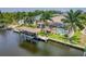 A beautiful waterfront home featuring a pool and private boat dock at 8180 Burwell Cir, Port Charlotte, FL 33981