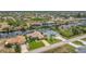 An aerial view of waterfront homes with boat docks on a sunny day at 8180 Burwell Cir, Port Charlotte, FL 33981