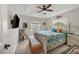 Inviting bedroom features a decorative ceiling, lots of light, and comfortable furniture at 8180 Burwell Cir, Port Charlotte, FL 33981