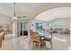Open floor plan with dining area and view of the pool and lanai at 8180 Burwell Cir, Port Charlotte, FL 33981