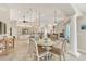 Open concept kitchen and dining area, with tiled floors and lots of natural light at 8180 Burwell Cir, Port Charlotte, FL 33981