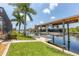 View of the boat lift and dock on the waterfront property at 8180 Burwell Cir, Port Charlotte, FL 33981