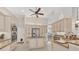 Open kitchen with granite countertops, stainless steel appliances, and central island cooktop at 8180 Burwell Cir, Port Charlotte, FL 33981