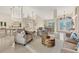 Inviting living room featuring tile floors, neutral décor, and an open layout perfect for gatherings at 8180 Burwell Cir, Port Charlotte, FL 33981