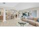 Spacious living room with an open floor plan that connects to the kitchen and dining area at 8180 Burwell Cir, Port Charlotte, FL 33981