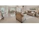 Bright open-concept living area with tile flooring, high ceilings, and a seamless flow for entertaining at 8180 Burwell Cir, Port Charlotte, FL 33981