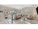 Comfortable living room with sliding glass doors providing access to a screened-in lanai and pool at 8180 Burwell Cir, Port Charlotte, FL 33981