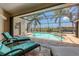 Inviting screened-in pool and spa area with plenty of room for relaxing and entertaining at 8180 Burwell Cir, Port Charlotte, FL 33981