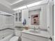 Modern bathroom with a walk-in shower and granite countertops at 8320 Creekview Ln, Englewood, FL 34224