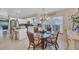 Breakfast nook near kitchen with bright lighting and clear table and seating for four at 8320 Creekview Ln, Englewood, FL 34224