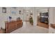 Bright foyer featuring wood-look floors, decorative furnishings, and a view into the living spaces at 8320 Creekview Ln, Englewood, FL 34224