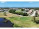 Picturesque golf course with water hazards and beautiful landscaping at 8320 Creekview Ln, Englewood, FL 34224