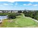 Scenic view of the golf course with lush green fairways and mature trees at 8320 Creekview Ln, Englewood, FL 34224