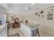 Eat-in kitchen featuring center island, stainless steel appliances and a dining area at 8320 Creekview Ln, Englewood, FL 34224