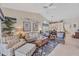 Inviting living room featuring comfortable seating, bright lighting, and stylish décor at 8320 Creekview Ln, Englewood, FL 34224