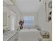 Relaxing main bathroom features a soaking tub and coastal decor at 8320 Creekview Ln, Englewood, FL 34224