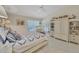 Bright main bedroom boasts beachy decor, vaulted ceiling, and lots of natural light at 8320 Creekview Ln, Englewood, FL 34224