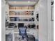Office features built-in shelving and storage for organization at 8320 Creekview Ln, Englewood, FL 34224
