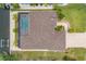 An aerial shot of a home and a screened-in pool with a stunning view of the waterfront and surrounding landscape at 8400 Antwerp Cir, Port Charlotte, FL 33981