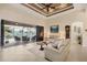 Spacious living room with tile floors, high ceilings, and access to a screened lanai at 8400 Antwerp Cir, Port Charlotte, FL 33981