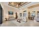 Spacious living room showcasing high ceilings, tile floors, and elegant furnishings at 8400 Antwerp Cir, Port Charlotte, FL 33981