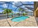 Relaxing screened pool with a scenic waterfront view of the canal at 8400 Antwerp Cir, Port Charlotte, FL 33981