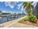 Picturesque waterfront scene with docks and boats, capturing the essence of tranquil waterfront living at 8400 Antwerp Cir, Port Charlotte, FL 33981