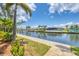 Waterfront view of a canal with docks and boats, showcasing the scenic surroundings and waterfront lifestyle at 8400 Antwerp Cir, Port Charlotte, FL 33981