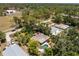 Aerial view showcases the home's setting near a park, highlighting its location within a tranquil and leafy neighborhood at 875 Morrison Ave, Englewood, FL 34223