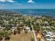 Panoramic aerial shot capturing the home's serene bayfront setting and verdant neighborhood landscape at 875 Morrison Ave, Englewood, FL 34223
