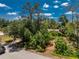An aerial view of a lush neighborhood, highlighting the home's secluded location at 875 Morrison Ave, Englewood, FL 34223