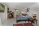 Bedroom featuring a desk, decor, natural light from multiple windows, and terrazzo flooring at 875 Morrison Ave, Englewood, FL 34223