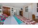 Bright bedroom features an ensuite bathroom, large windows, and natural light at 875 Morrison Ave, Englewood, FL 34223