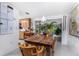 Bright dining space featuring a rustic table, wicker chairs and easy access to an outdoor patio at 875 Morrison Ave, Englewood, FL 34223