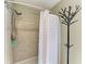 Well-maintained bathroom showcasing shower with neutral tile and updated fixtures at 9211 Koma St, Port Charlotte, FL 33981