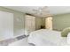 Well-lit bedroom with a decorative armoire and access to bathroom at 9211 Koma St, Port Charlotte, FL 33981
