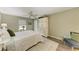 Comfortable bedroom with a bed and ceiling fan and nice furnishings at 9211 Koma St, Port Charlotte, FL 33981