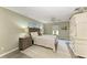 Cozy bedroom with a wooden bed frame, ceiling fan, and two nightstands at 9211 Koma St, Port Charlotte, FL 33981