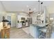 Bright kitchen with stainless appliances, breakfast bar with seating, and modern finishes is perfect for cooking and entertaining at 9211 Koma St, Port Charlotte, FL 33981